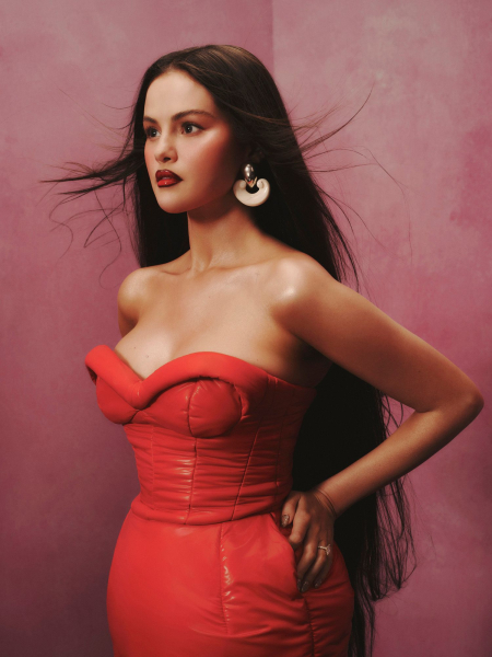 Selena gomez wearing a red pleather strapless dress