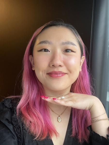 A selfie of Allure commerce editor Sarah Han after applying Eadem Le Chouchou Exfoliating  Softening Peptide Lip Balm